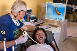 Child getting treatment by dentist using Primescan