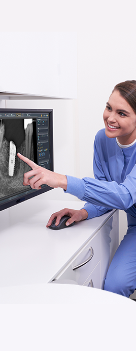 Smiling dentist with implant software