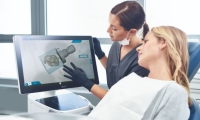 Dentist and patient watching CEREC Software