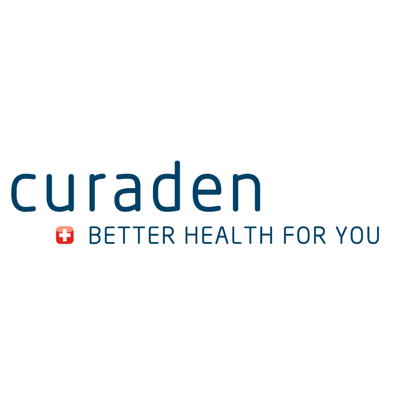 Front of Dentsply Sirona office building with trees and hedges in foreground.