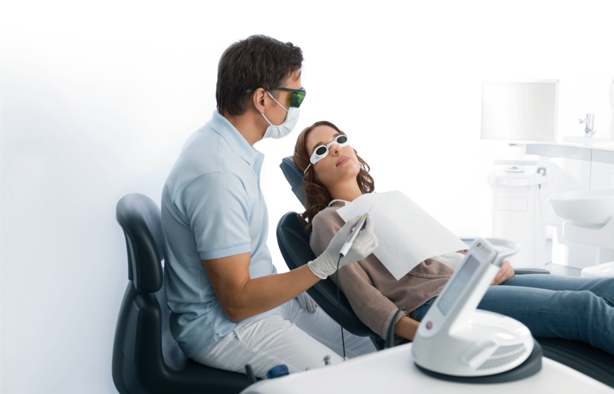 Dentist using dental diode laser