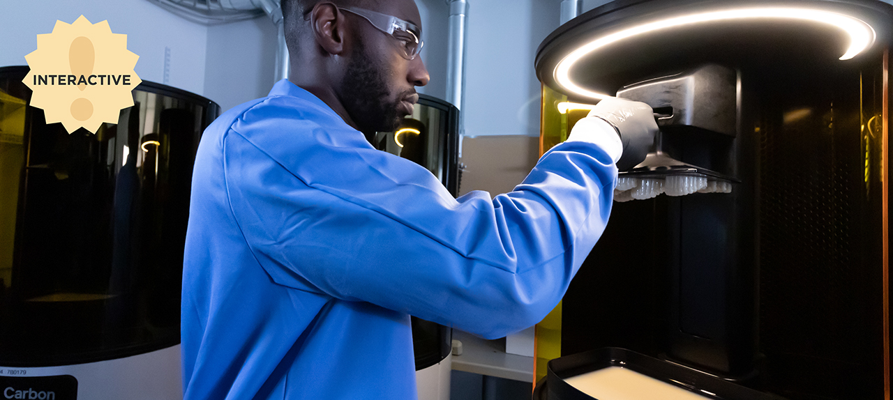Male dental professional using digital denture machinery