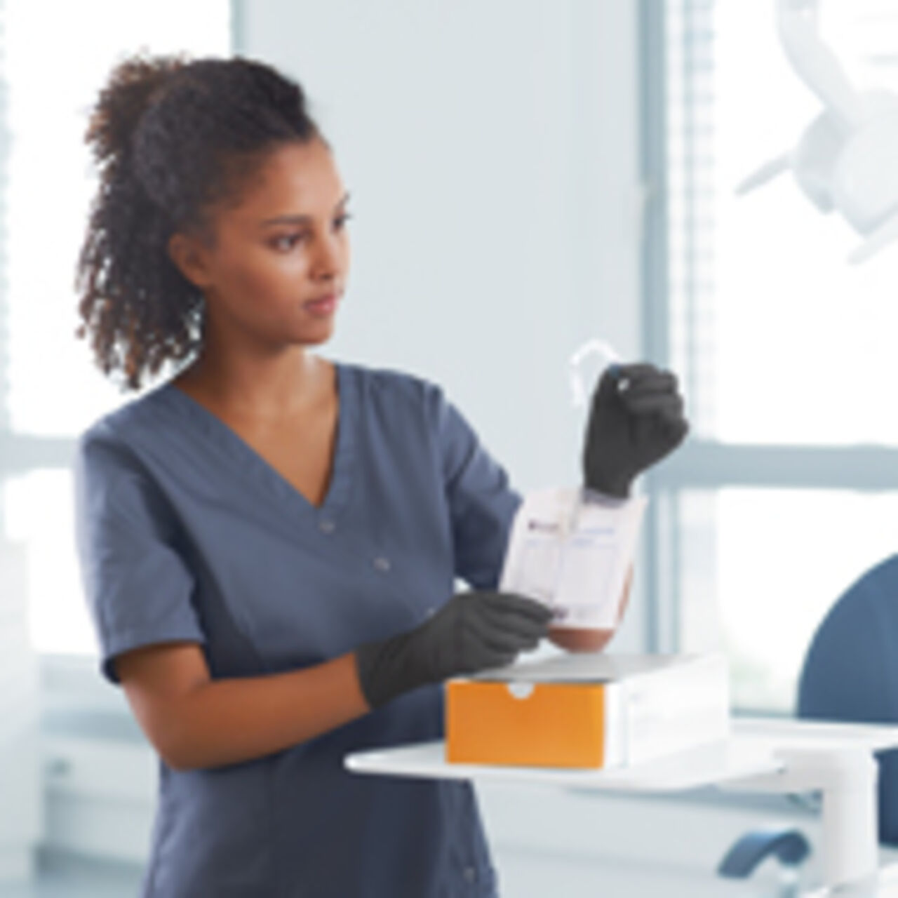 Assistant unpacks SureSmile Aligners