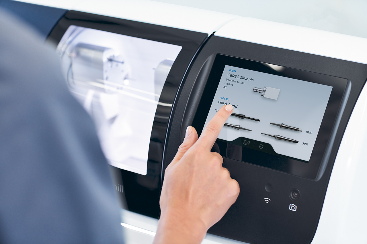 Finger touching touch display of CEREC Primemill