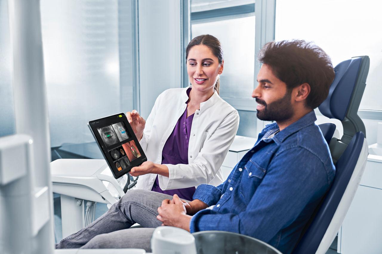 Dentist showing patient DS Core communication canvas