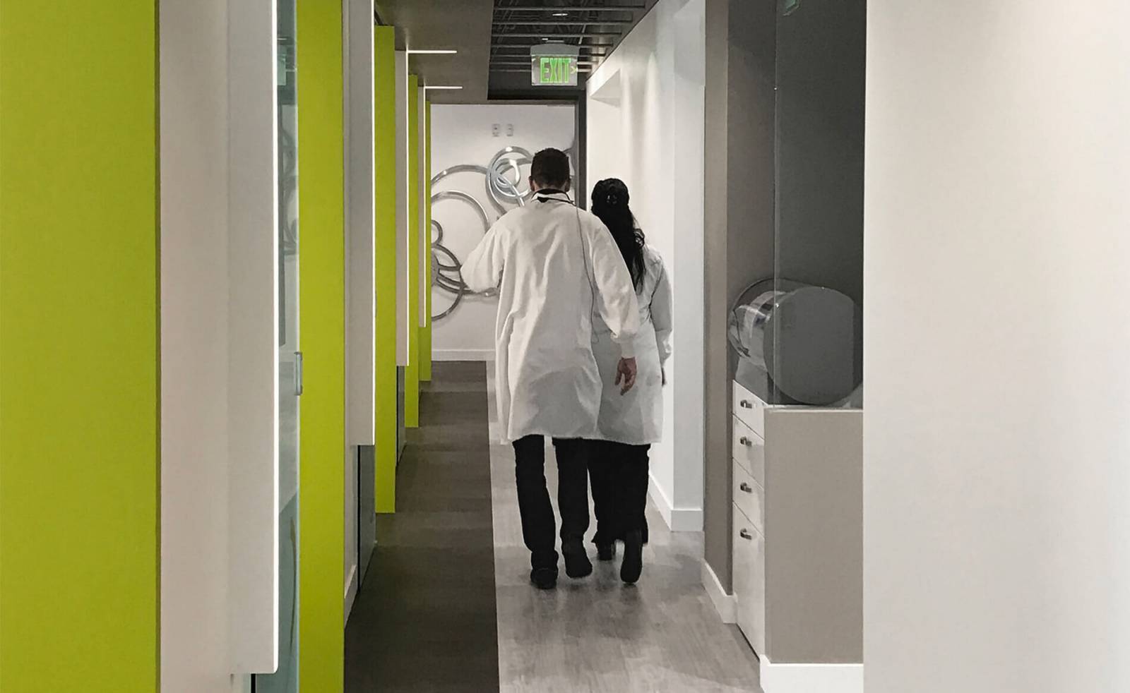 Dental Office Hallway & Equipment with Dentists Walking