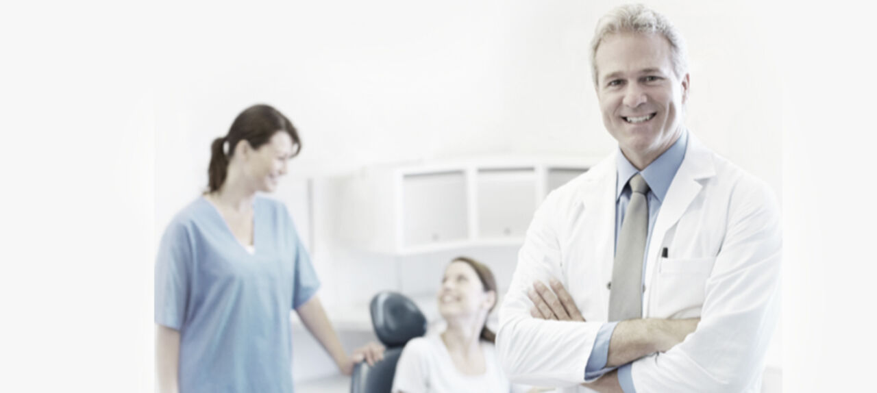 Dental professionals in clinical training with obturation practice session