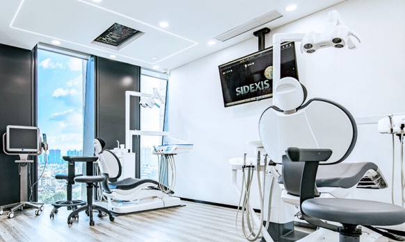 A treatment room at DENSDE Dental with modern Dentsply Sirona treatment centers.